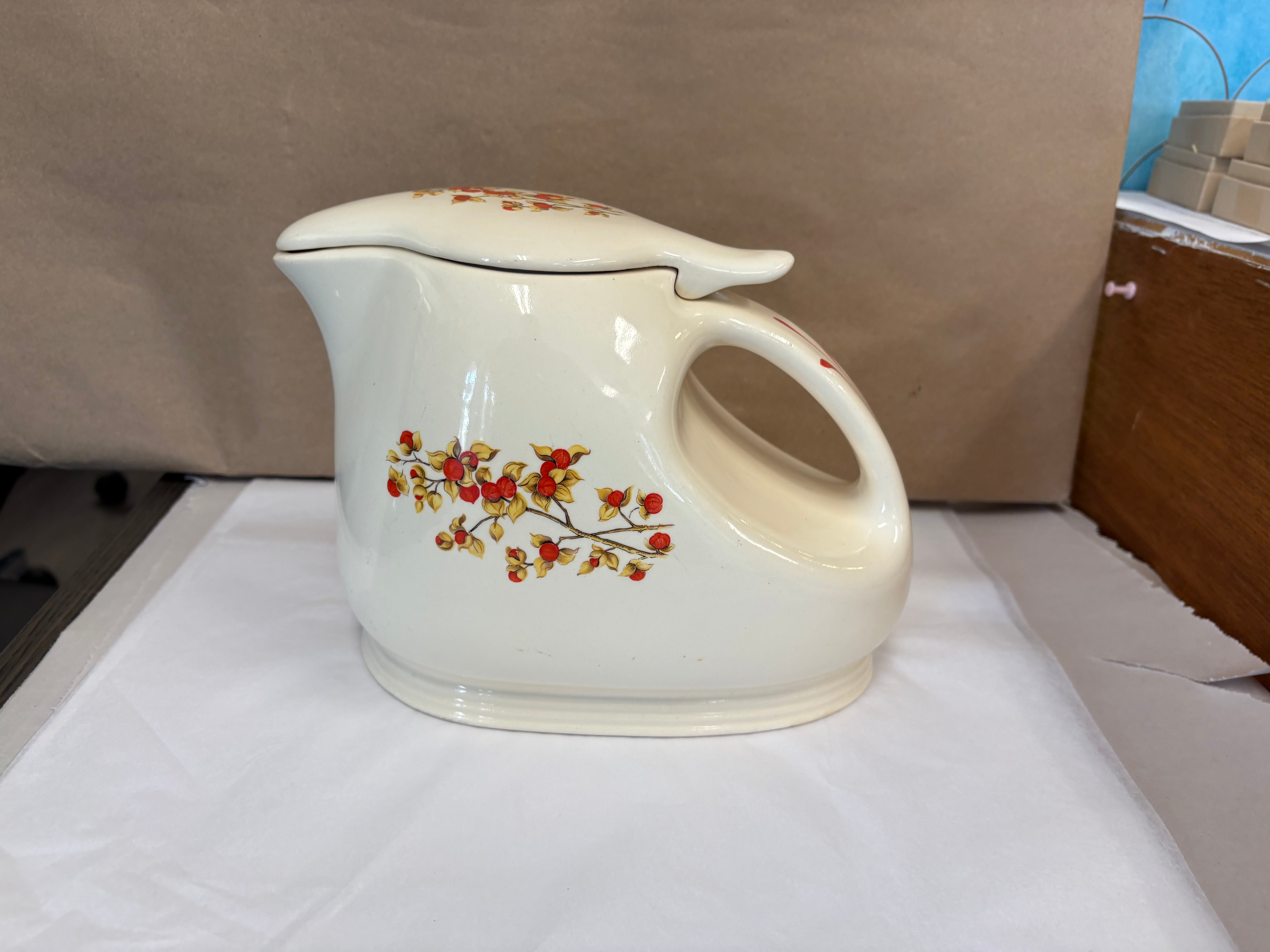 Covered coffee pot in bittersweet pattern made by the Oxford Ware China Company.