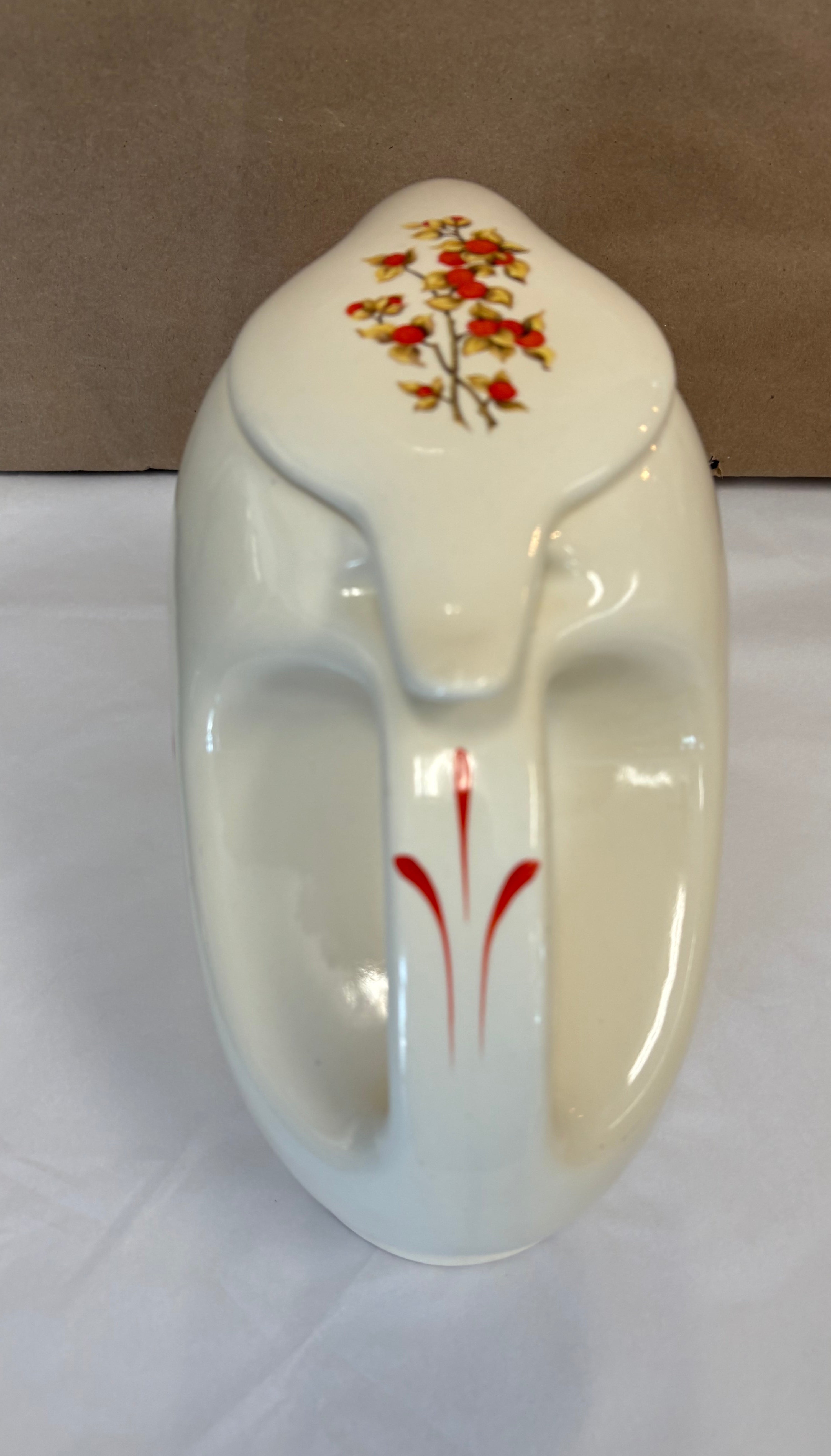 Covered coffee pot in bittersweet pattern made by the Oxford Ware China Company.