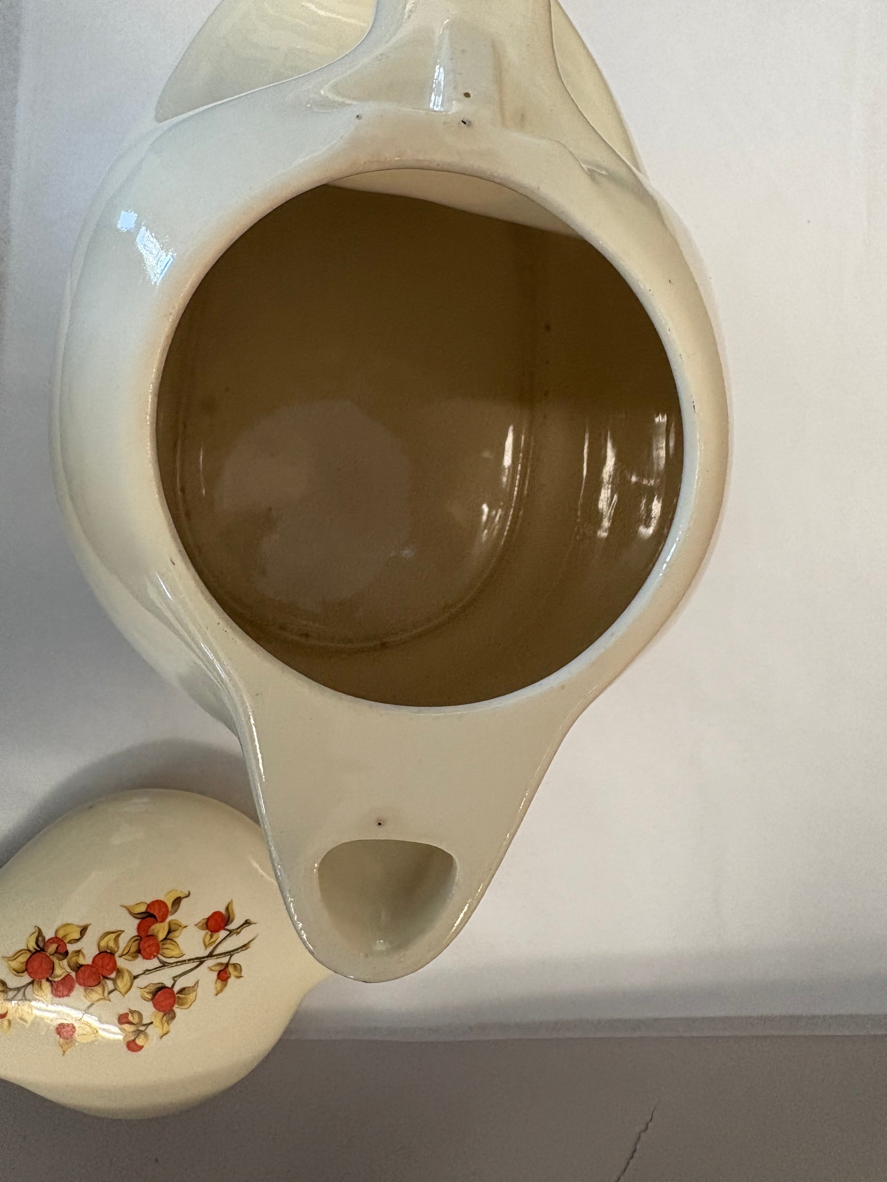 Covered coffee pot in bittersweet pattern made by the Oxford Ware China Company.