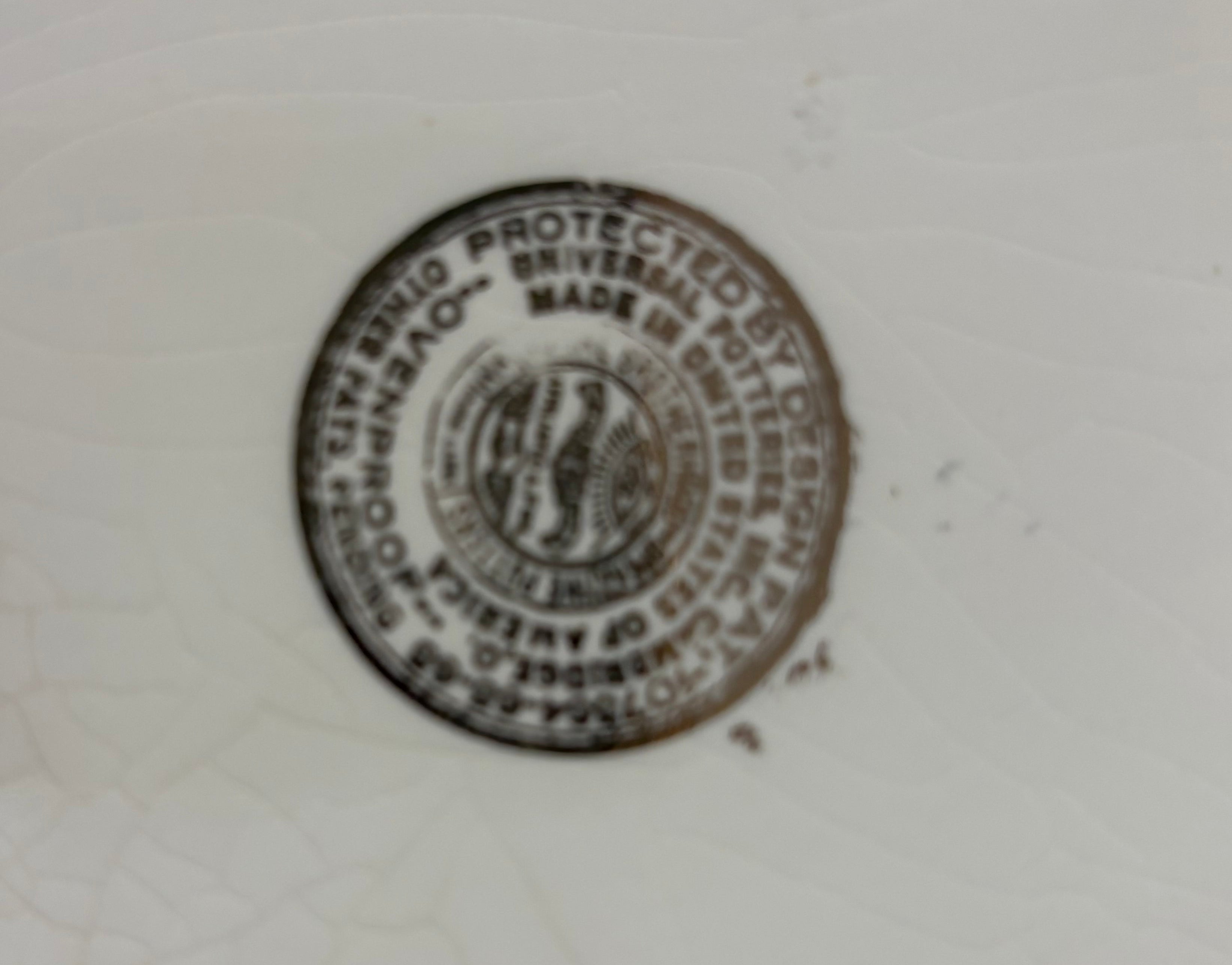 Covered coffee pot in bittersweet pattern made by the Oxford Ware China Company.