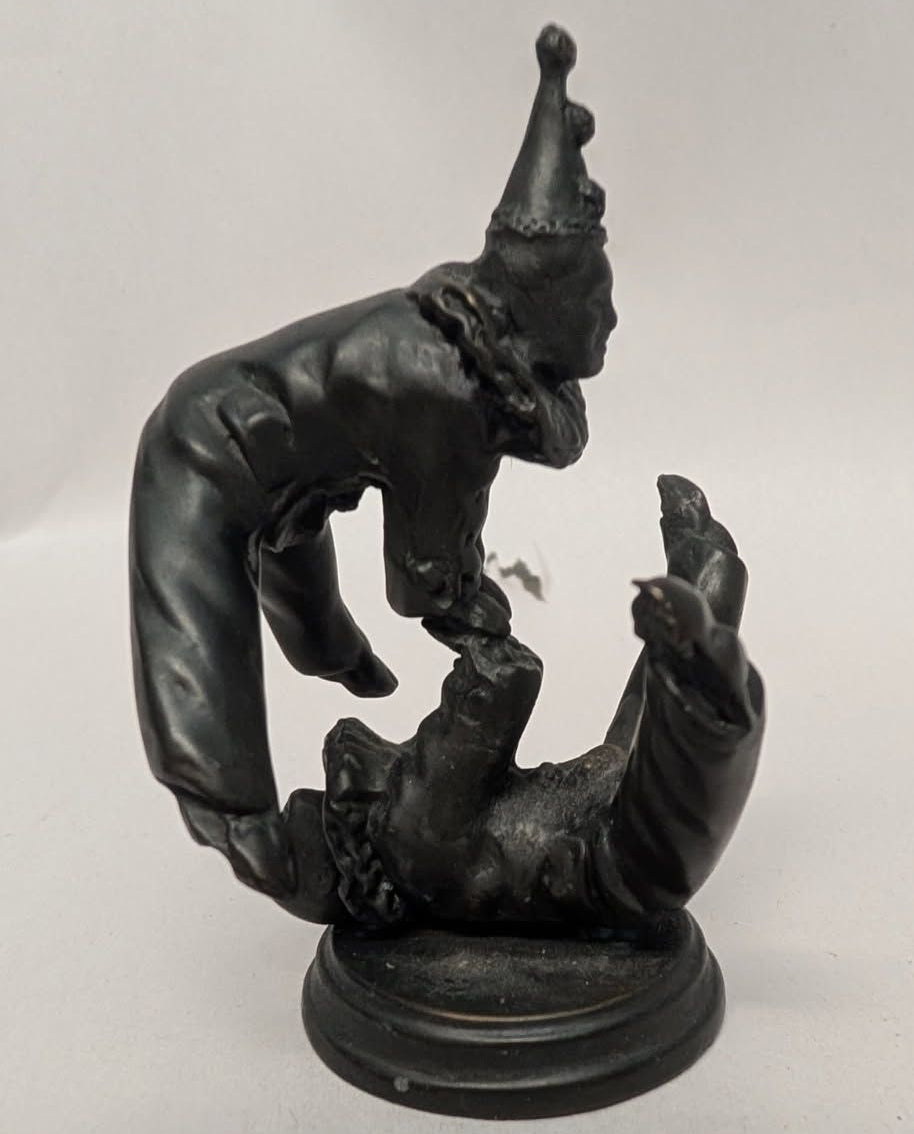 2 Bronze clown acrobats.