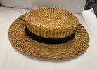 Antique straw boater hat with a black band and bow