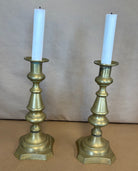 pair of tall brass candle sticks
