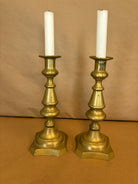 pair of tall brass candle sticks