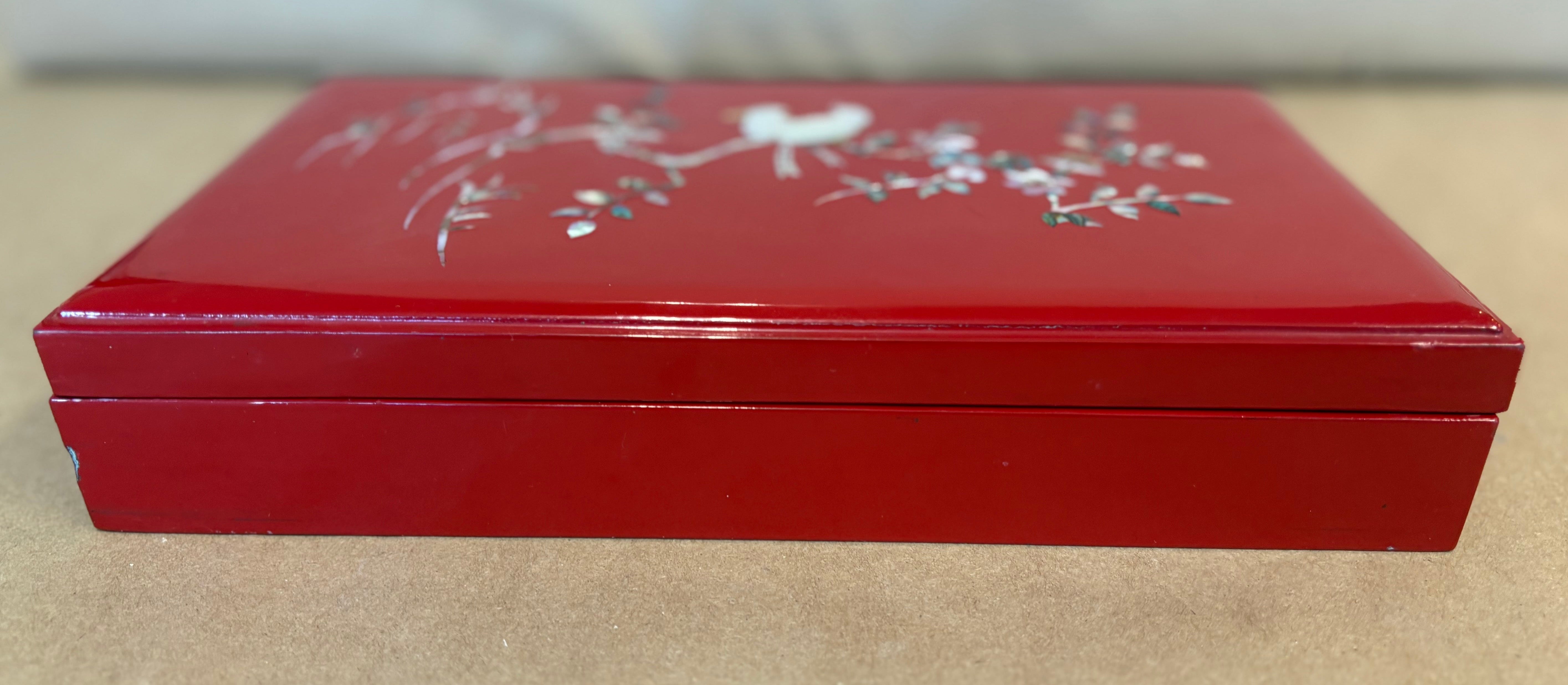 Red lacquer cigarette box with mother of pearl
