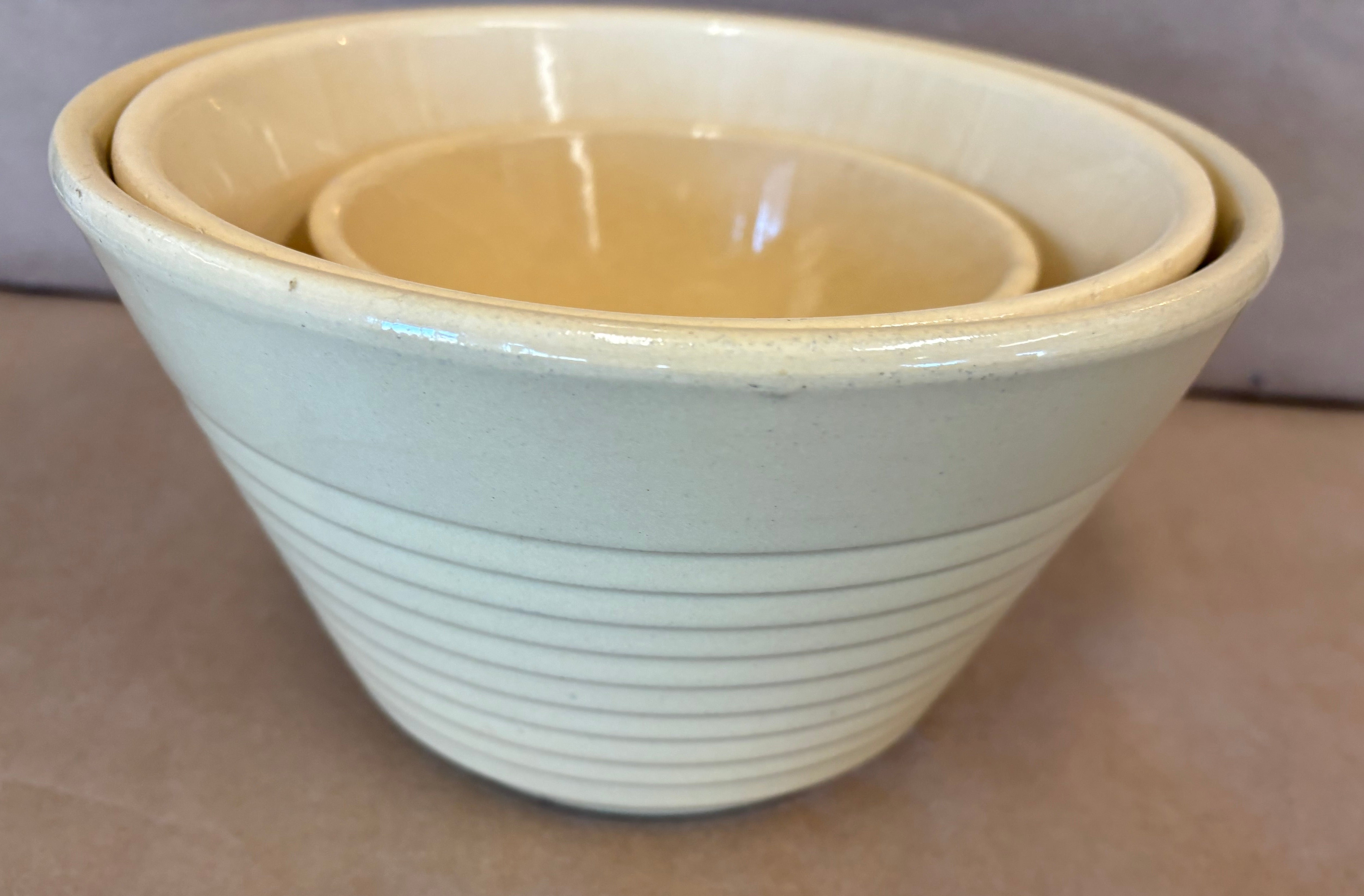 Set of three Watt Ware rippled apple nesting bowls