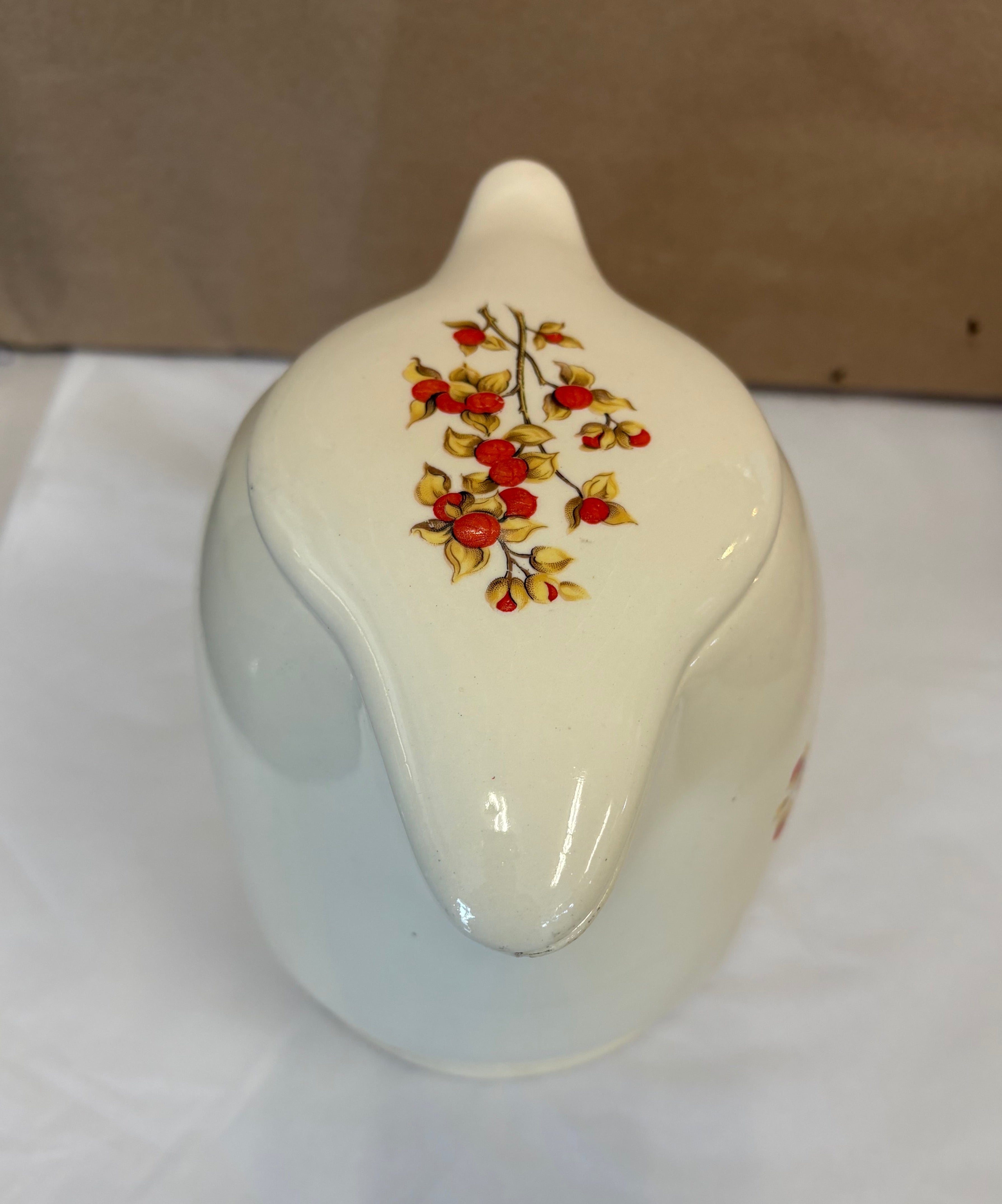 Covered coffee pot in bittersweet pattern made by the Oxford Ware China Company.