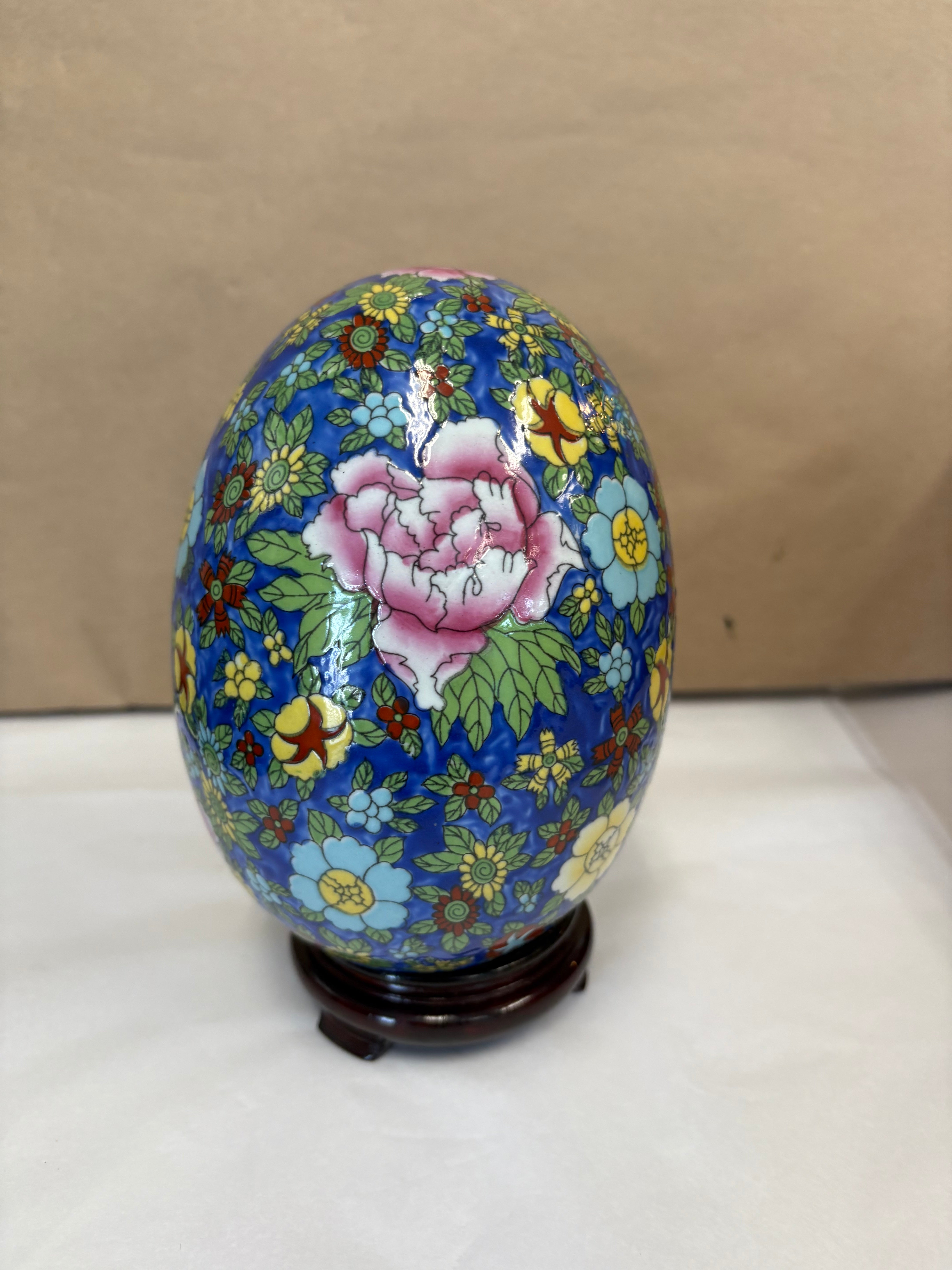 Large hand painted enameled egg with stand