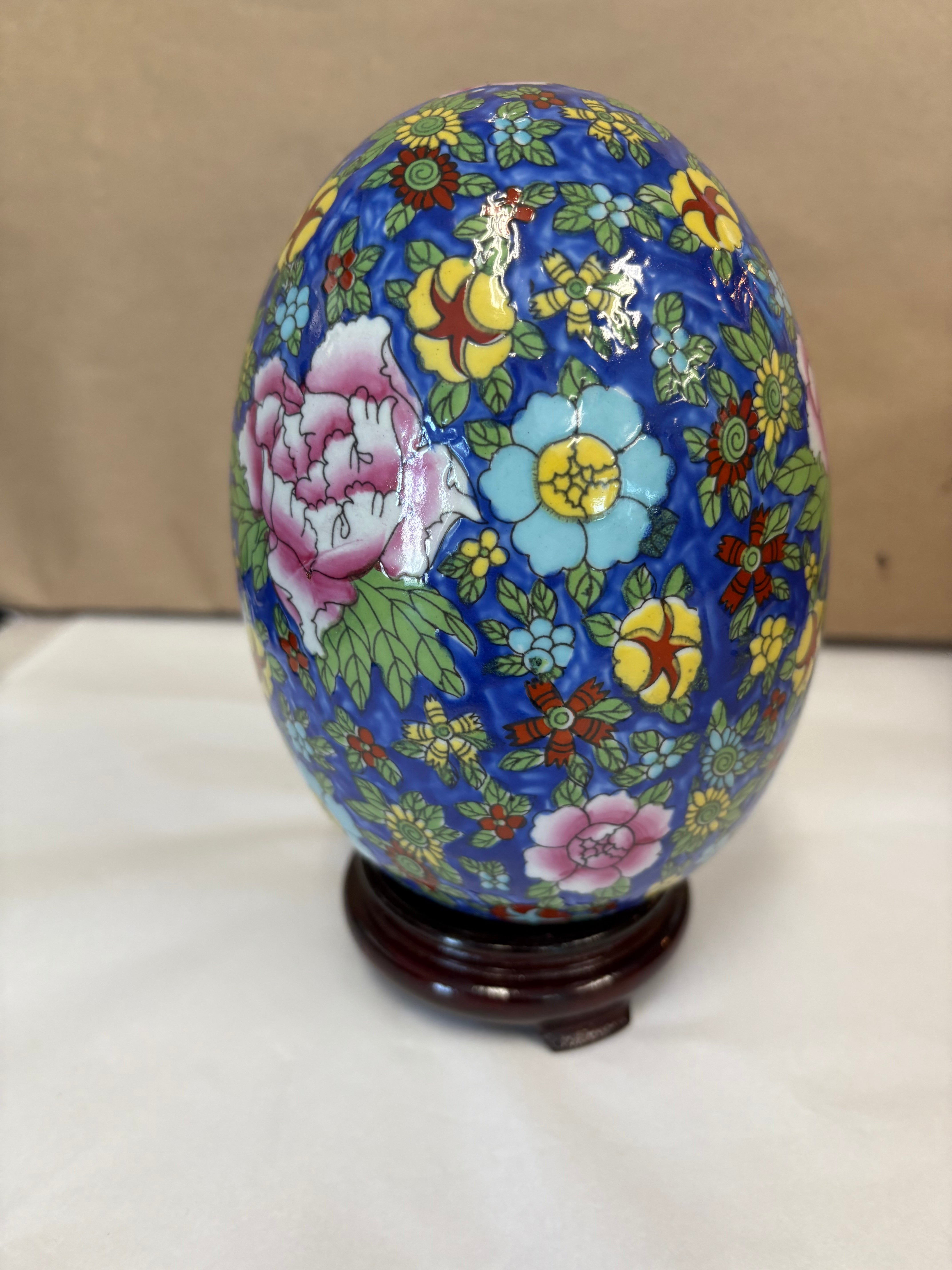 Large hand painted enameled egg with stand
