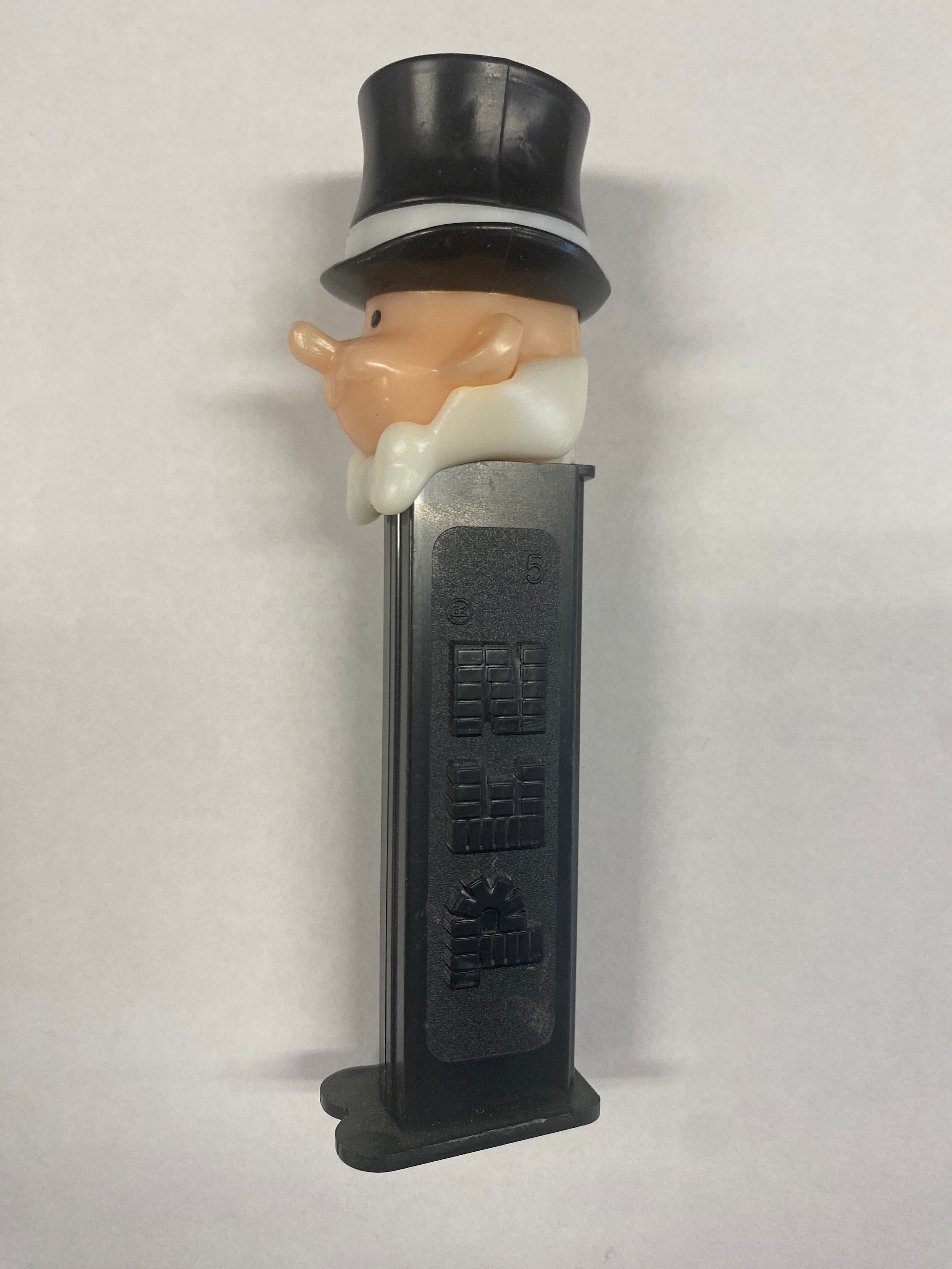 pez, pez dispenser, pez candy, collectible, vintage , groom, black and white