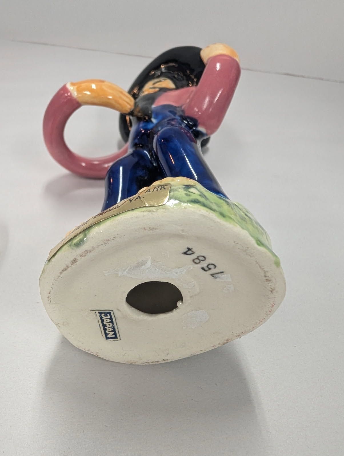 Salt & pepper shaker of an oriental man carrying jugs