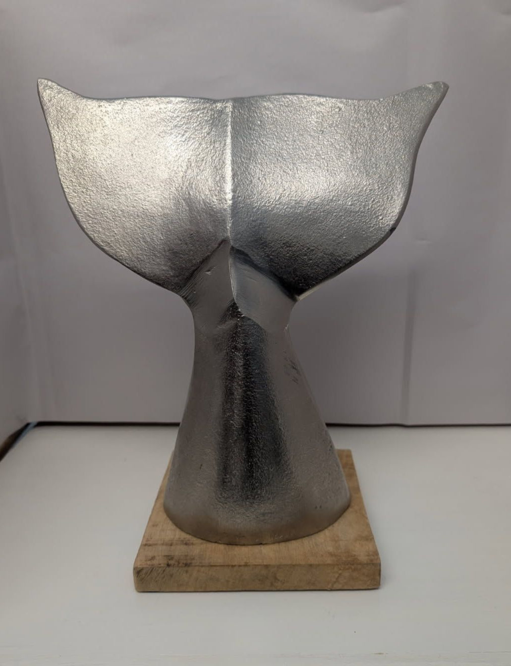 Silver Whale's Tail on wood base