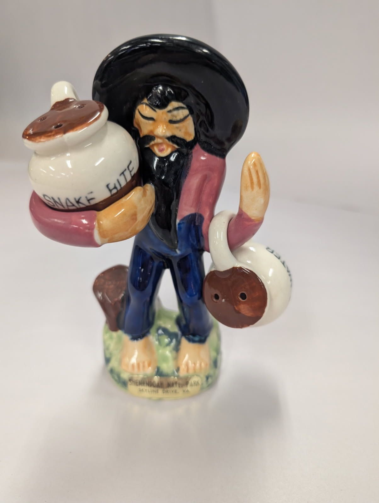 Salt & pepper shaker of an oriental man carrying jugs